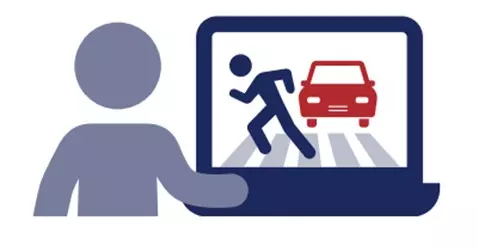 An illustration of a person sitting at a laptop with an illustration on the screen of a person running through a pedestrian crosswalk in front of a car.